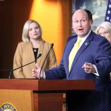 Congressman Langworthy Standing At A Podium 